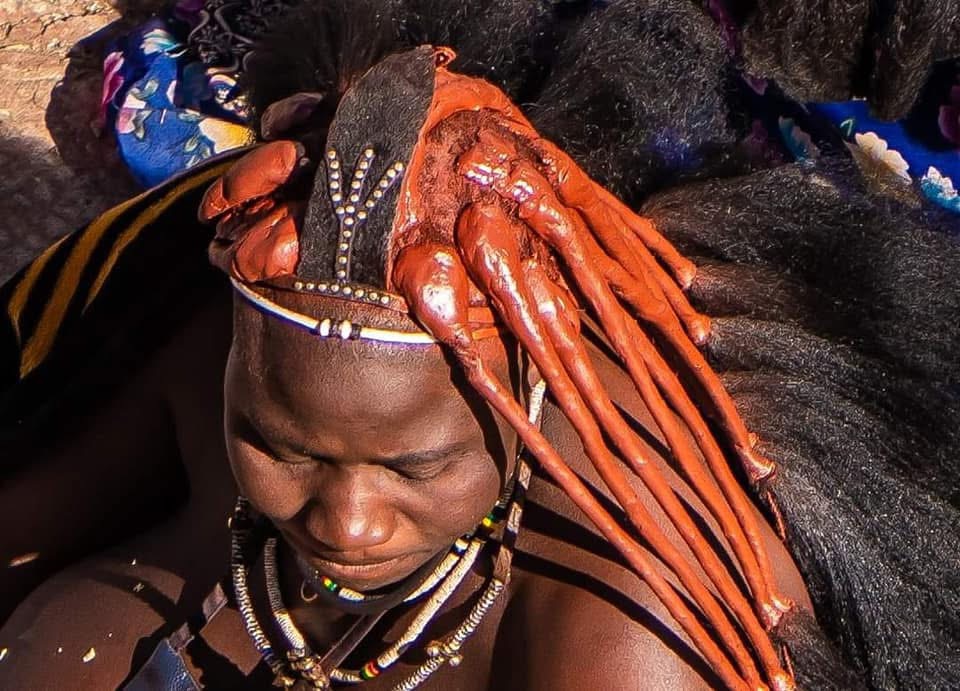 Portrait of a Himba woman with ochre-coloured hair