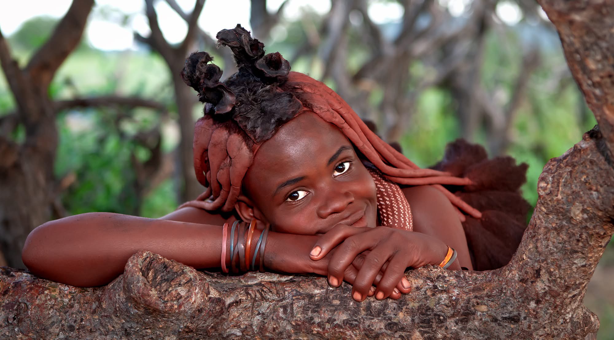 Portrait of a Himba woman with ochre-coloured hair