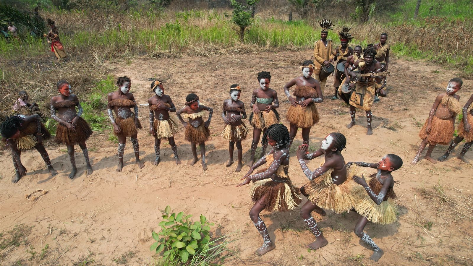 Villagers dancing in a clearing