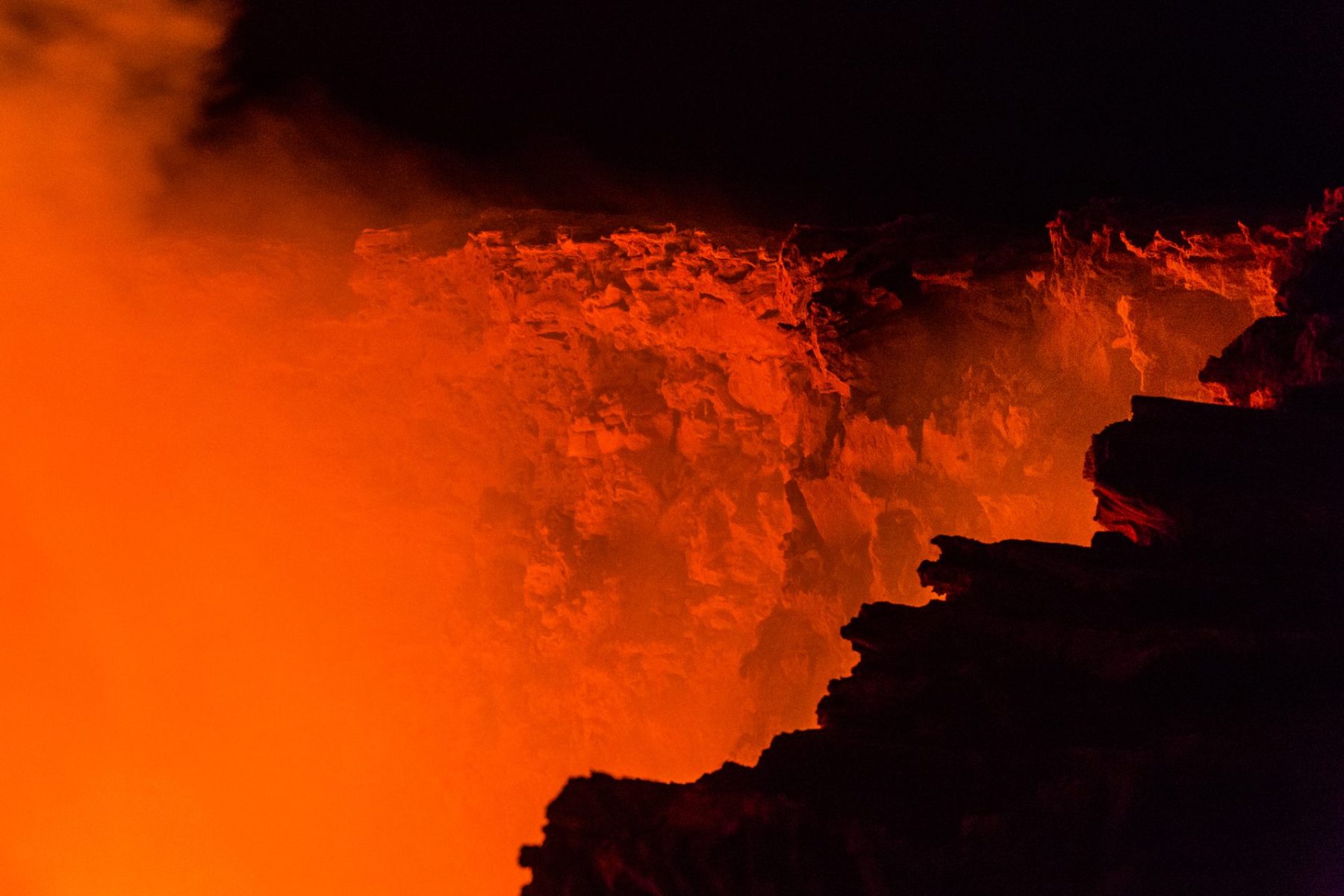 Glowing lava lake at night