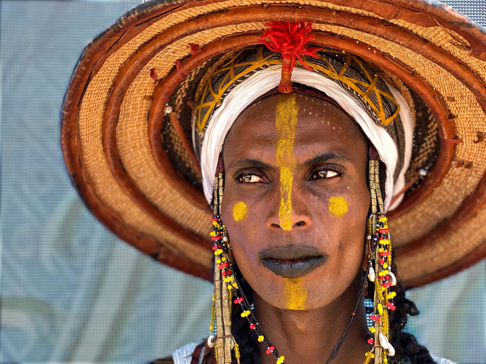 Man in a wide-brimmed festival hat
