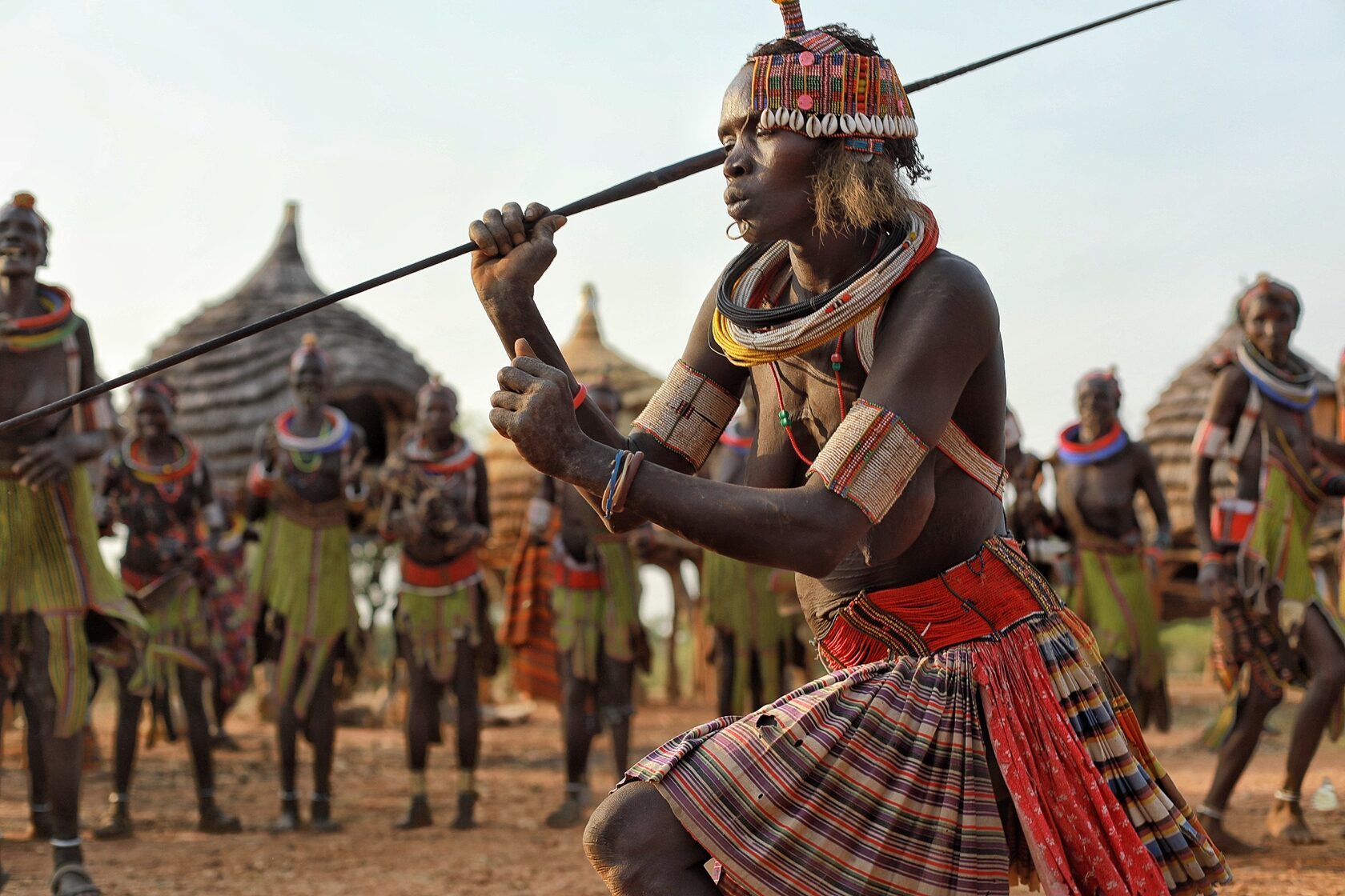 Dancer with a spear at a village celebration